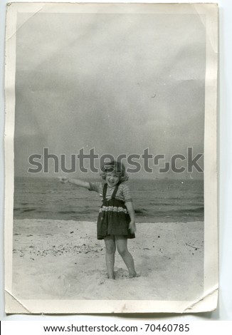 Vintage unretouched photo of young girl on beach