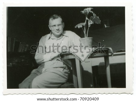 Vintage photo of man sitting (fifties)