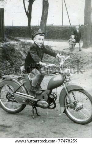 Vintage photo of boy on motorbike (early sixties)