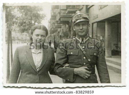 Vintage photo of young soldier and his wife (forties)
