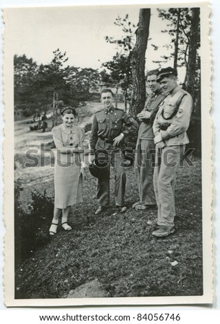 Vintage photo of young people outdoor (thirties)