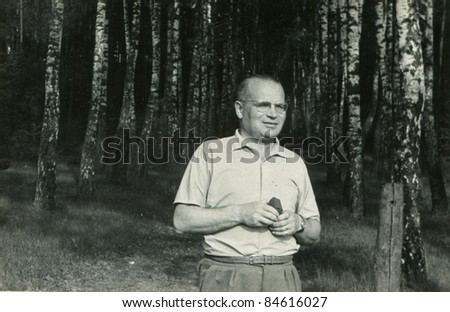 Vintage photo of  man in forest (fifties)