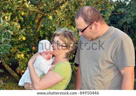 Parents with their 2 months old baby girl
