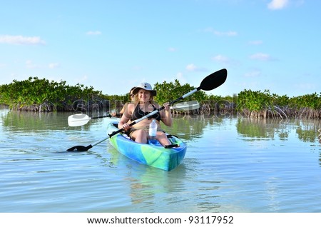 Girls kayaking in in Sian Ka an Biosphere Reserve, Tulum, Mexico