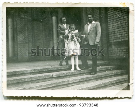 Vintage photo of girl with parents - First Communion (fifties)