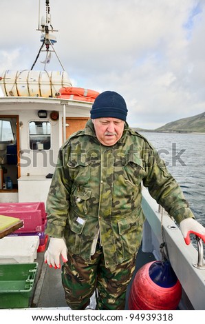 Senior  fisherman on boat (deep sea fishing)