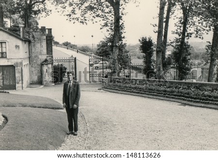 Vintage photo of man in front of his house, fifties