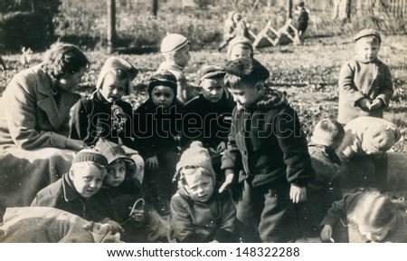 LODZ, POLAND, CIRCA FIFTIES - vintage photo of group of pupils in kindergarten , Lodz, Poland, circa fifties