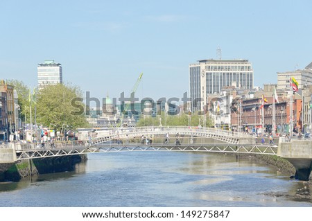 DUBLIN, IRELAND - JUNE 7: Millenium Bridge and Ha\'penny Bridge, River Liffey Dublin, Ireland on June 7, 2013