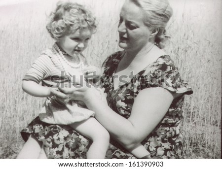 Vintage photo of mother and daughter, fifties