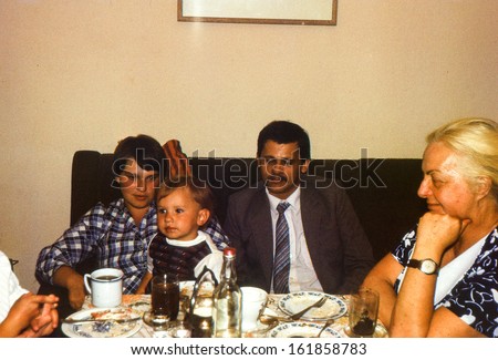 Vintage photo (scanned reversal film) - - family dinner, early eighties