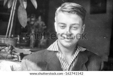 Vintage photo of young smiling boy, sixties