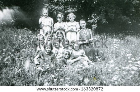 LODZ,POLAND, CIRCA FIFTIES -  unidentified big family members posing outside, in the garden - circa fifties