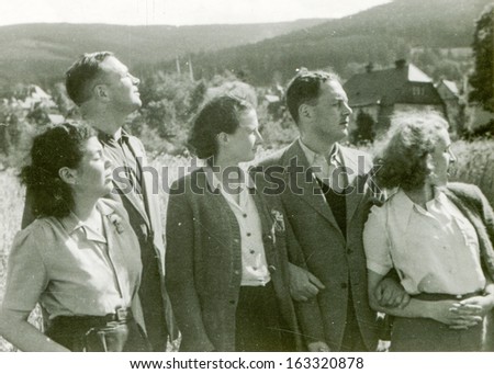 POLAND, CIRCA FIFTIES -  unidentified young women and men posing outside in mountains - in Poland, circa fifties