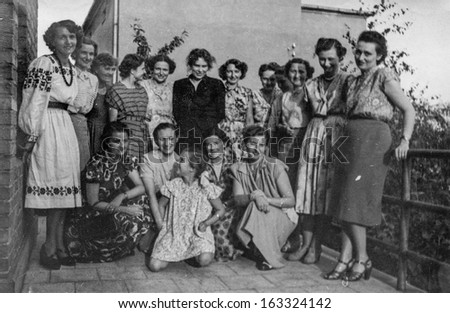 LODZ,POLAND, CIRCA FORTIES -  vintage photo of group of unidentified women and a little girl posing on balcony - circa forties