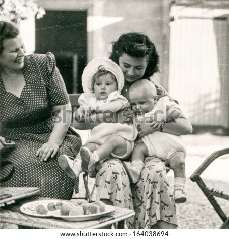 LODZ, POLAND, CIRCA FIFTIES: vintage photo of grandmother, mother and two babies, Lodz, Poland, circa fifties