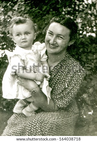 LODZ, POLAND, CIRCA FIFTIES: vintage photo of mother and baby daughter, Lodz, Poland, circa fifties
