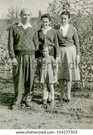 RISHON LE ZION, ISRAEL - CIRCA SIXTIES: vintage photo of parents with two unidentified  daughters, Rishon Le Zion, Israel, circa sixties