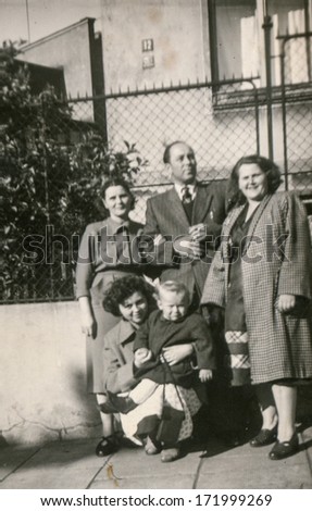 BIELSKO, POLAND, CIRCA 1940s - vintage photo of happy family with a child outdoor