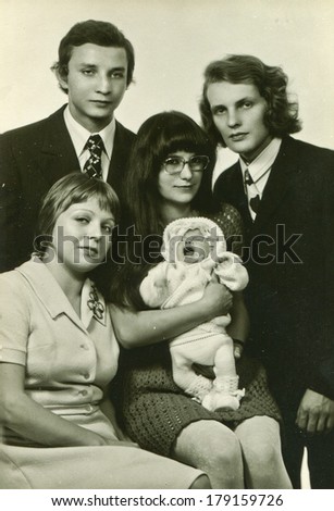 LODZ, POLAND,CIRCA SEVENTIES- vintage photo of parents and godparents with a baby (christening)