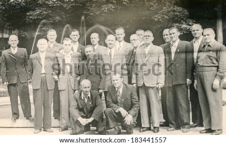 LODZ, POLAND, CIRCA 1970\'s: Vintage photo of group of men posing outdoor