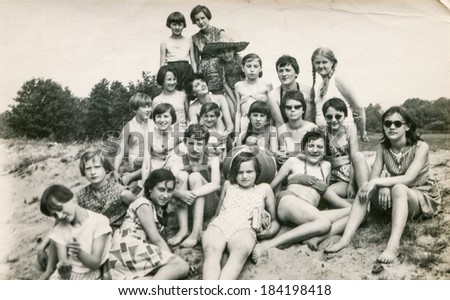 POLAND, CIRCA 1970\'s: Vintage photo of group of  young girls and teachers posing together  during a summer camp