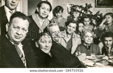 LODZ, POLAND, CIRCA 1950\'s: Vintage photo of people during a family dinner