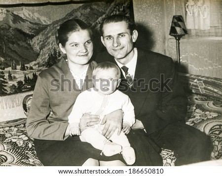 SZCZECINEK, POLAND, CIRCA 1950's: Vintage photo of parents with a baby