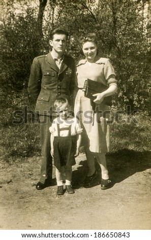 LODZ, POLAND, CIRCA 1950\'s: Vintage photo of parents with a little boy