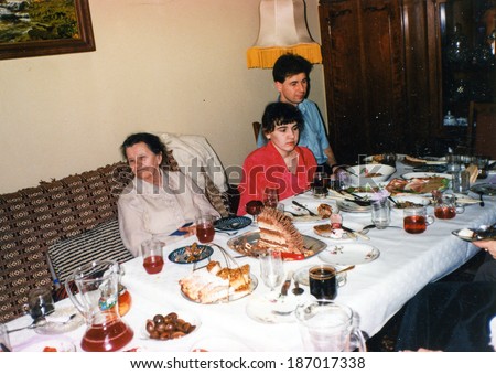 LODZ, POLAND CIRCA 1970\'s: Vintage photo of people enjoying a family party