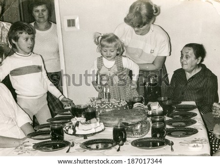LODZ POLAND CIRCA 1970's Vintage photo of family enjoying a family party child birthday LODZ POLAND CIRCA 1970's Vintage photo of family enjoying a family party child birthday