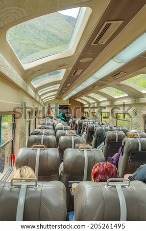 PERU, OLLANTAYTAMBO, MAY 4, 2014 - tourists travel from Machu Picchu to Ollantaytambo by luxurious train with panoramic view.