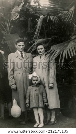 SIERADZ, POLAND, CIRCA FIFTIES - Vintage photo of parents with their daughter