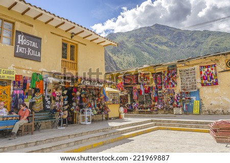 OLLANTAYTAMBO, PERU, MAY 4, 2014 - Plaza de Armas with souvenirs shops and hostal