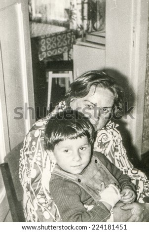 LODZ, POLAND, JULY 27, 1981 : Vintage photo of grandmother with grandson