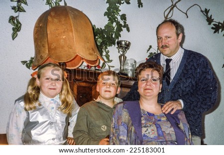 Vintage photo of parents with daughter and son, eighties