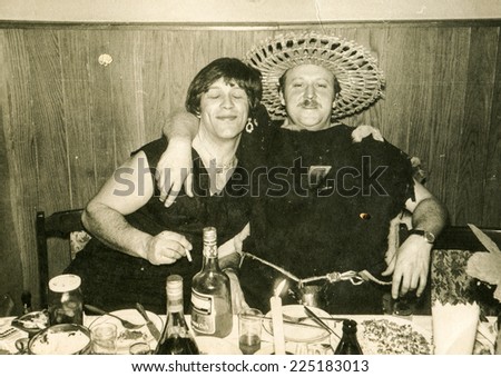Vintage photo of two brothers in costumes during a fancy dress party, early eighties