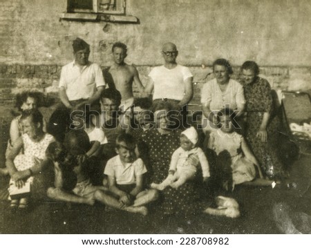 POLAND, CIRCA FIFTIES: Vintage photo of group of big multigenerational family outdoor