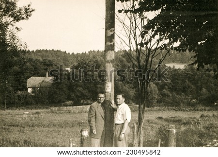 POLAND, CIRCA FIFTIES: Vintage photo of two men outdoor