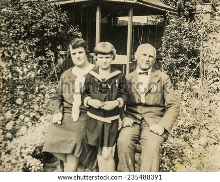 GERMANY, CIRCA 1930s: Vintage photo of parents with their daughter