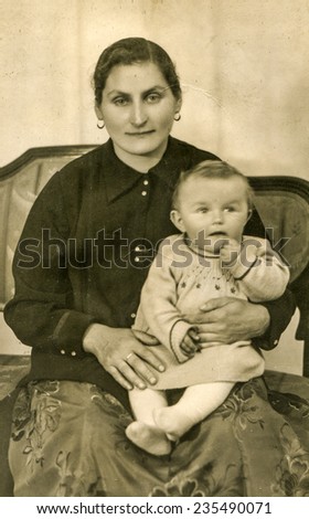 GERMANY, CIRCA 1942: Vintage photo of mother with her baby