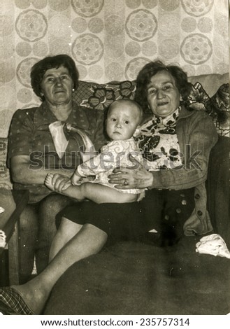 GERMANY, CIRCA FIFTIES: Vintage photo of grandmothers with their grandchild