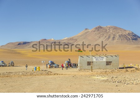 BOLIVIA, MAY 17, 2014: Tourists come to border control point near Bolivia/Chile border in the middle of desert