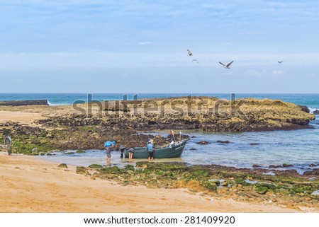 OUALIDIA, MOROCCO, APRIL 6, 2015: Fishermen  go to sea in fishing boat