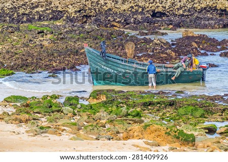 OUALIDIA, MOROCCO, APRIL 6, 2015: Fishermen prepare their boat to go fishing
