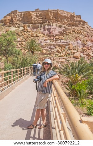 Female tourist on bridge to Ait Benhaddou, Morocco