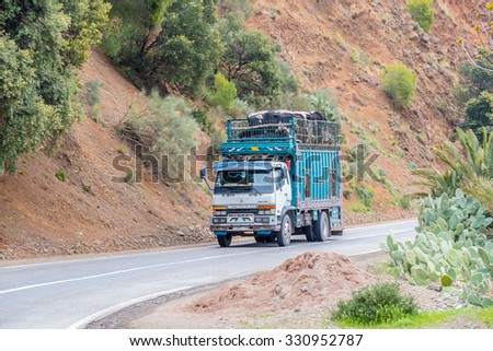 TADDERT, MOROCCO, APRIL 15, 2015: Lorry transports sheep and cows in region of Tizi n\'Tichka mountain pass