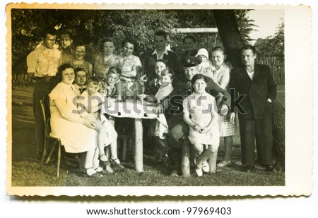 Vintage photo of big happy family outdoor (fifties)