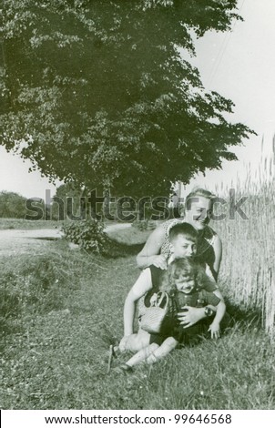 Vintage photo of mother, son and daughter - fifties
