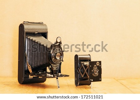 20 JANUARY 2014 - ENGLAND - Vintage Kodak No 3A Folding Pocket camera, 1903 to 1915; and Eastman Kodak Vest Pocket Autographic Special folding camera, 1916 to 1923, known as the \